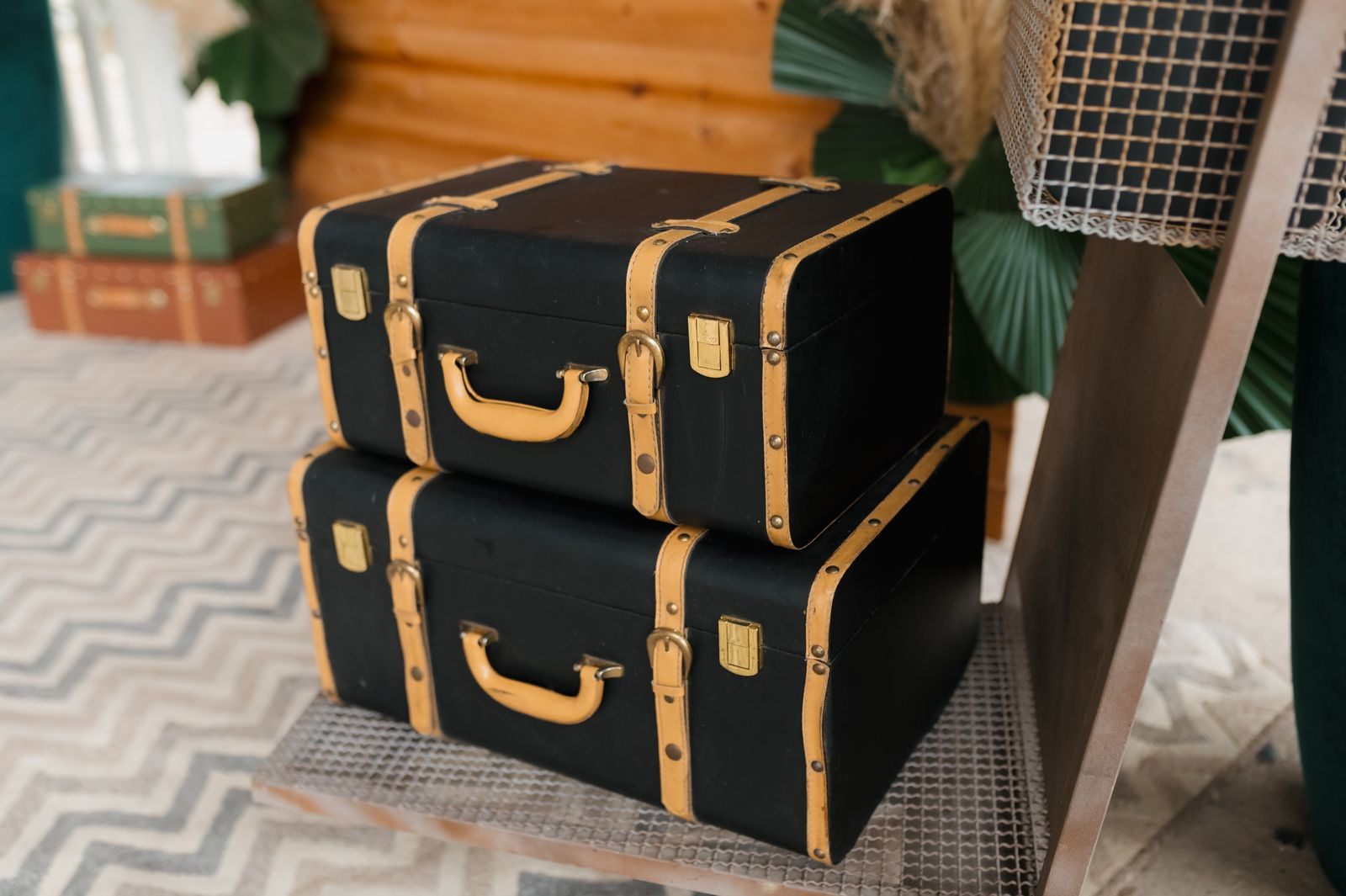 Stack of vintage black suitcases ready for a trip
